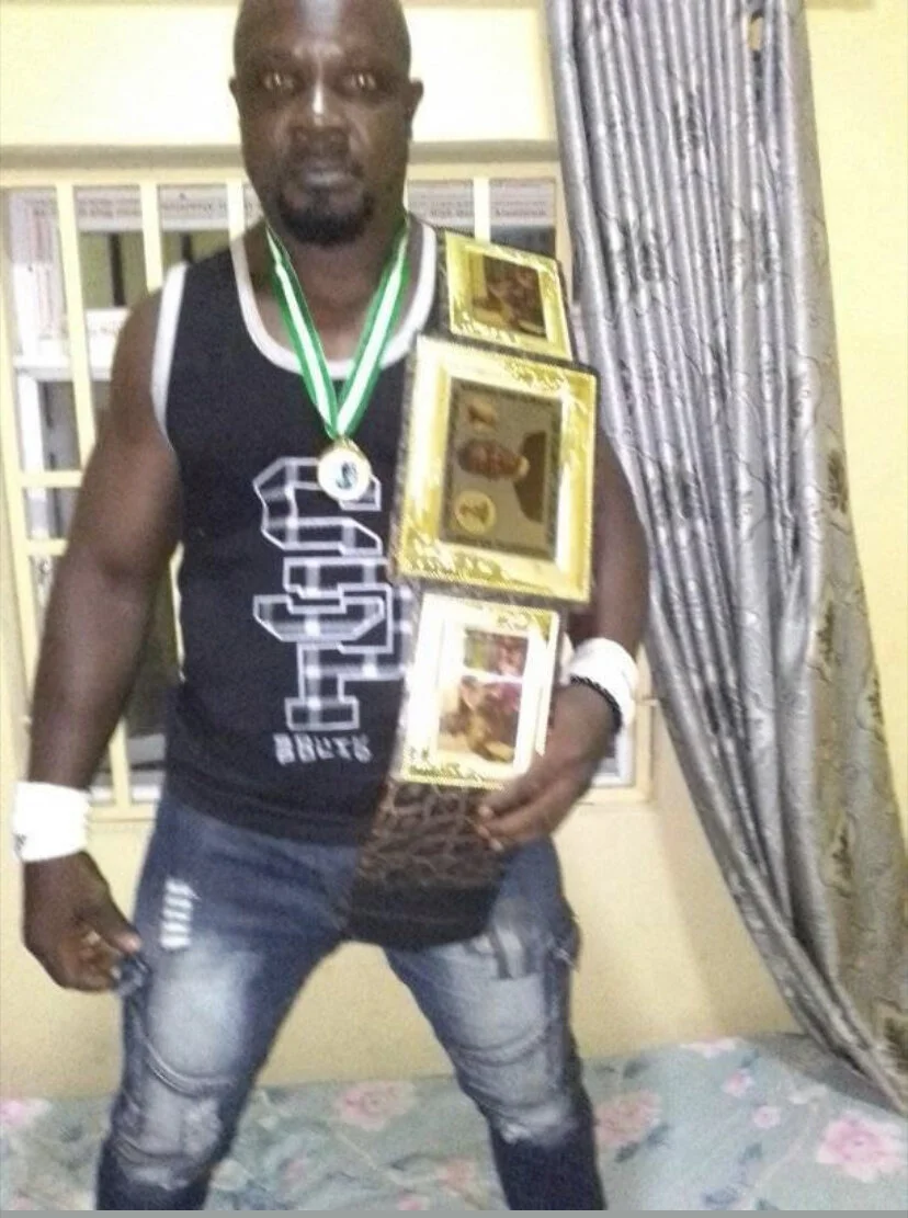 Mighty Man showing off his new championship belt after his big victory on Sunday