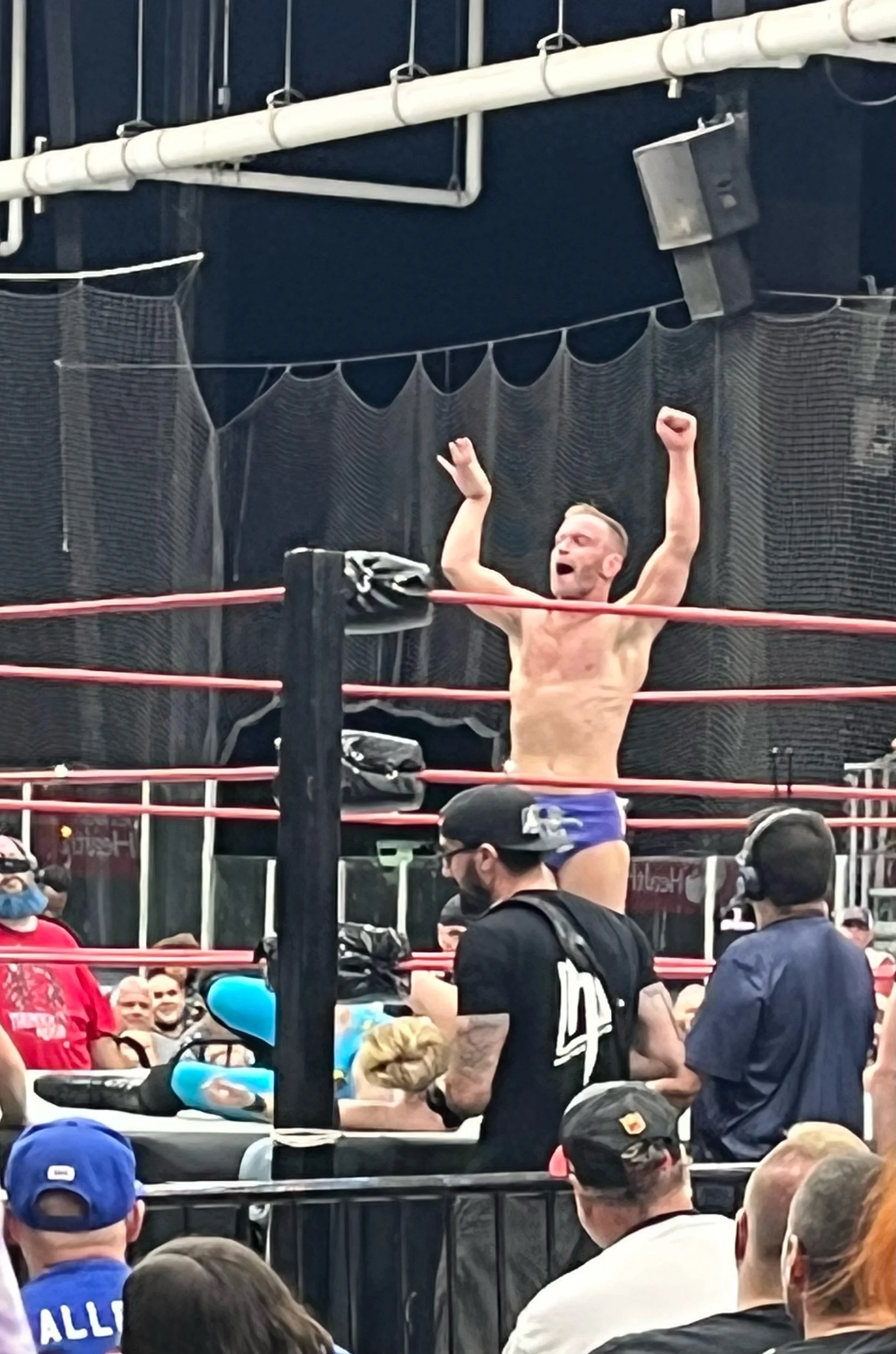 Gregory Iron celebrates after taking Vinnie Moon down to the mat