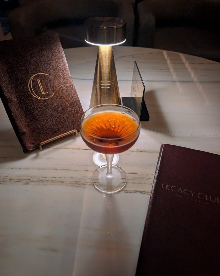 Curled up in a booth with a black manhattan: my happy place