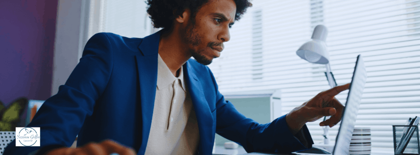 Black man searching intently online.