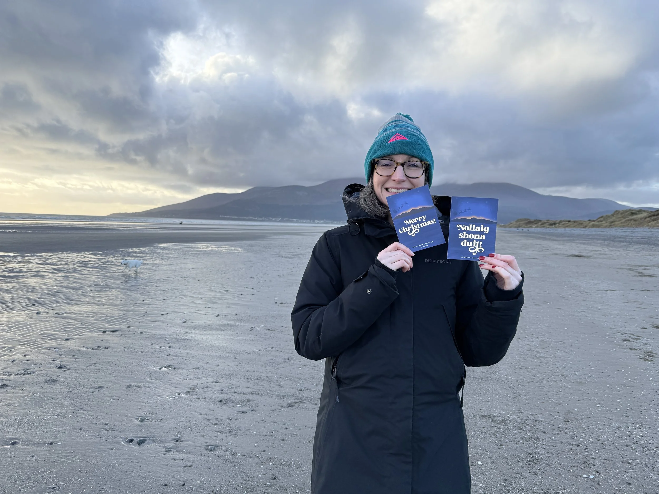 Louise from Slieve Studio holding Irish language Christmas cards.JPG