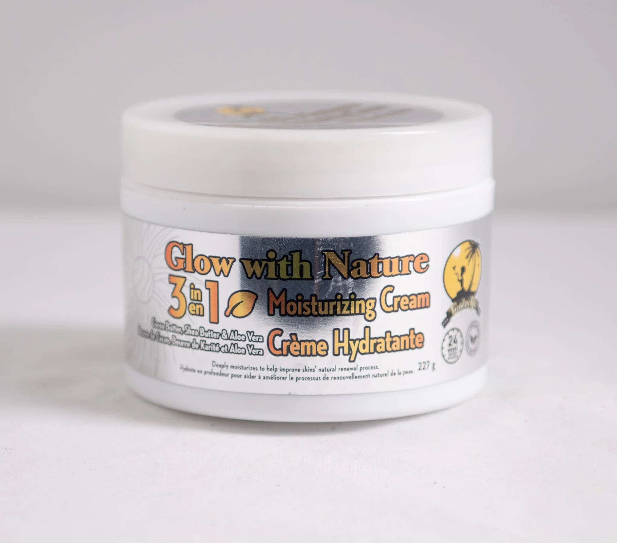 White jar of Glow with Nature 3 in 1 Moisturizing Cream with aloe vera and shea butter, with product label showing.