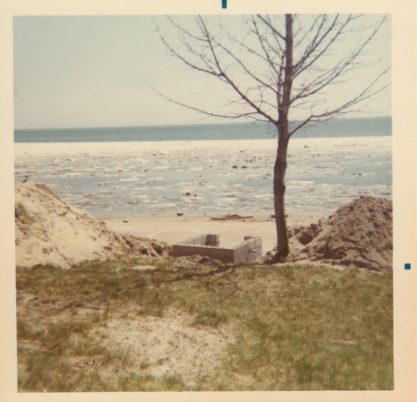 Top of pump house will be level with bank (1970)