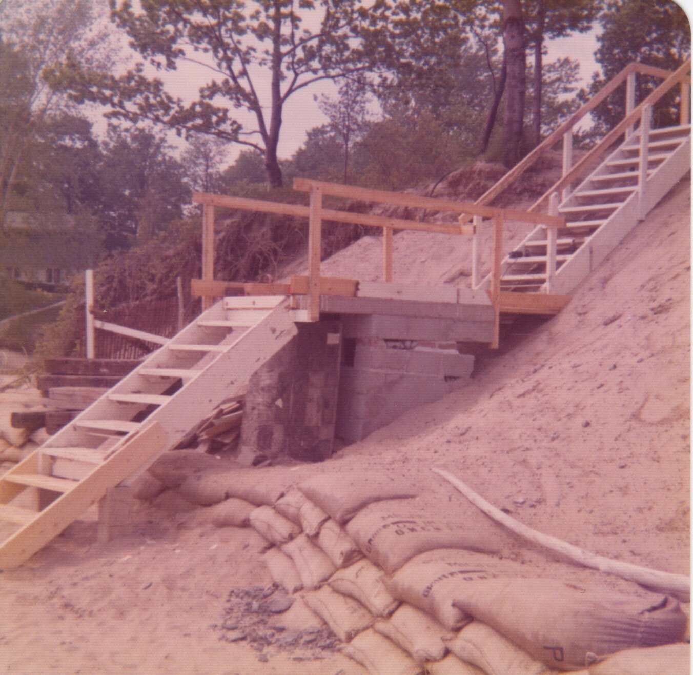 Two runs of stairs now to reach the beach with a landing on the pump house ruins (1971)
