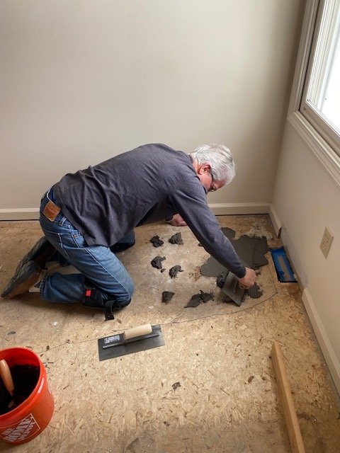 After we tore up the carpet and screwed down the floors to reduce squeaks we decided the floor needed leveling to meet the vinyl plank flatness recommendations.