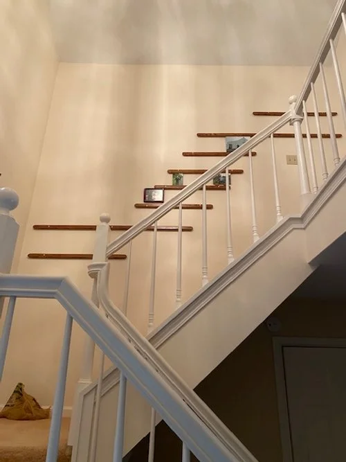 First upgrade was to add picture rails from the first landing up to the second floor. This view looking up from front entry.