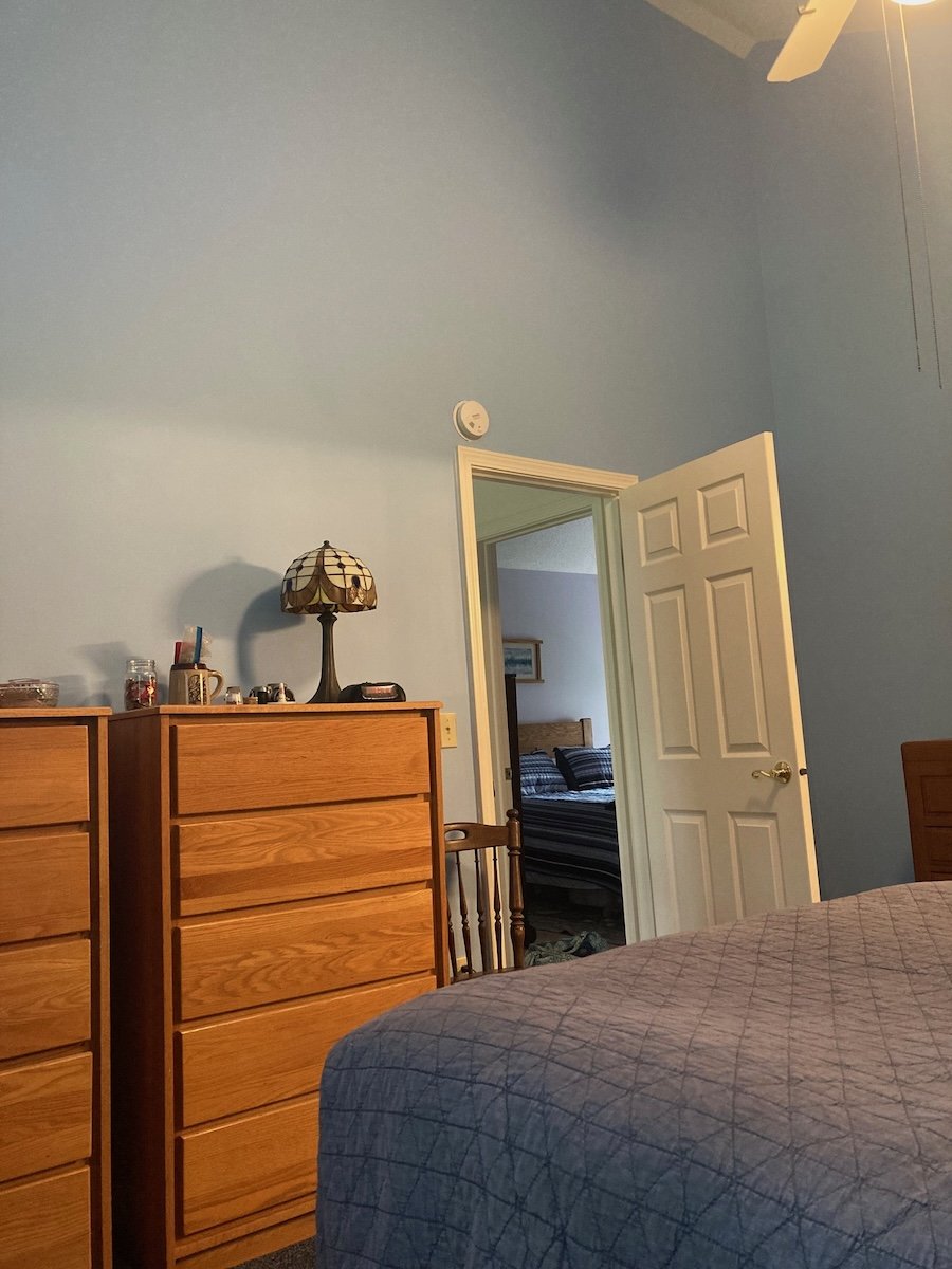 Master bedroom after Pam painted using new ladder to reach 15 foot walls on one side.