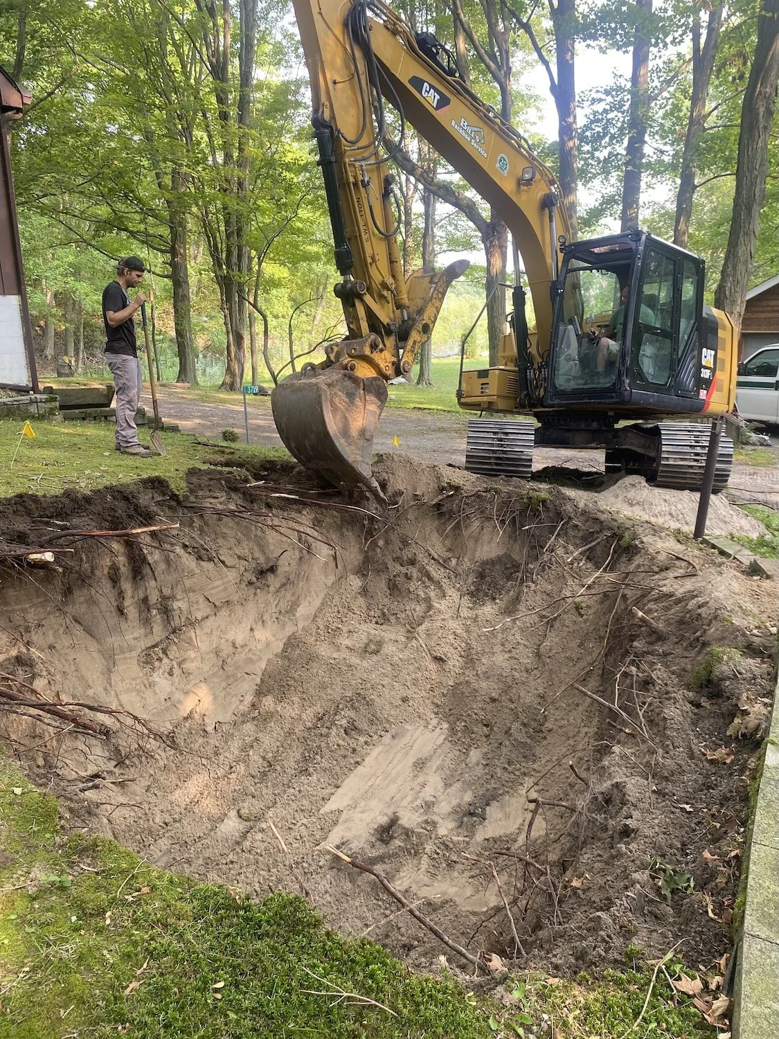 First came a big hole in the hill along side the driveway.