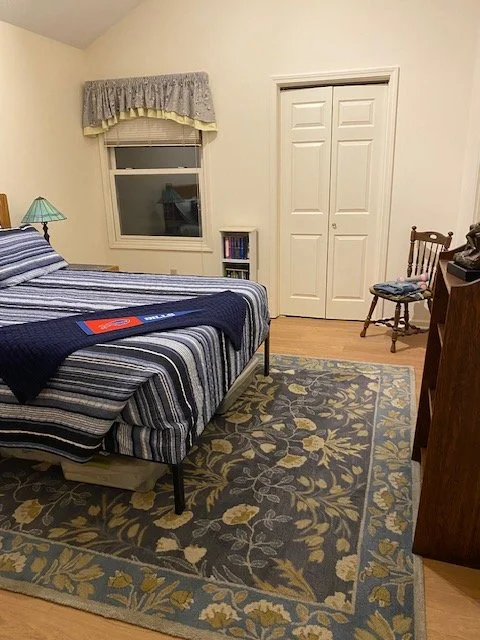 The guest room reassembled. Walls painted, floor down, new shoe molding and new track light heads.