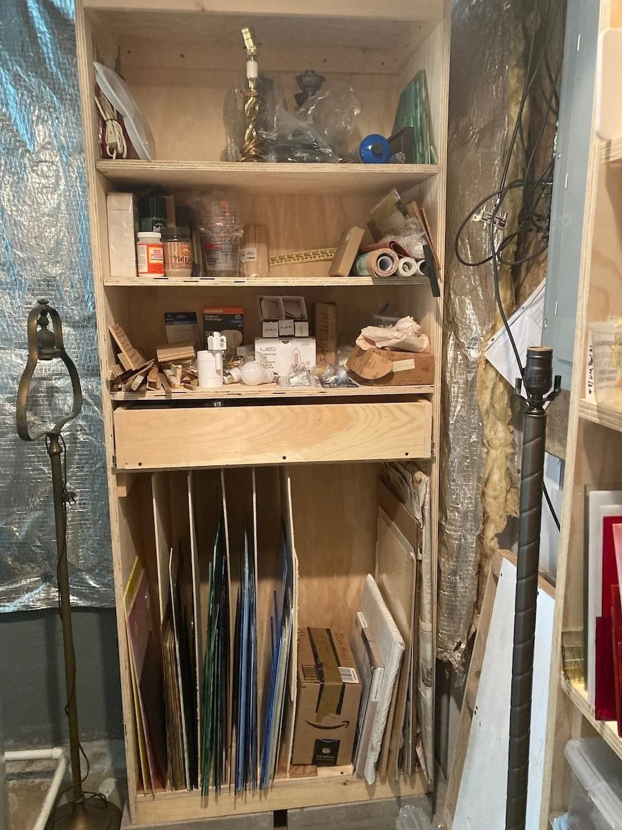 Glass shelving with drawer and glass.