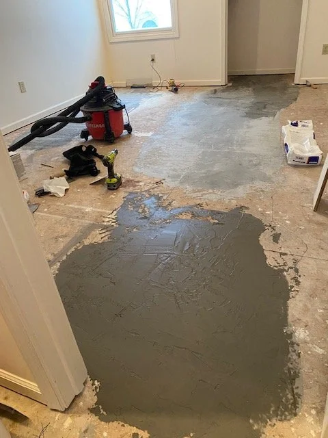 About a hundred pounds of concrete leveling compound later we were almost ready to start the floor.