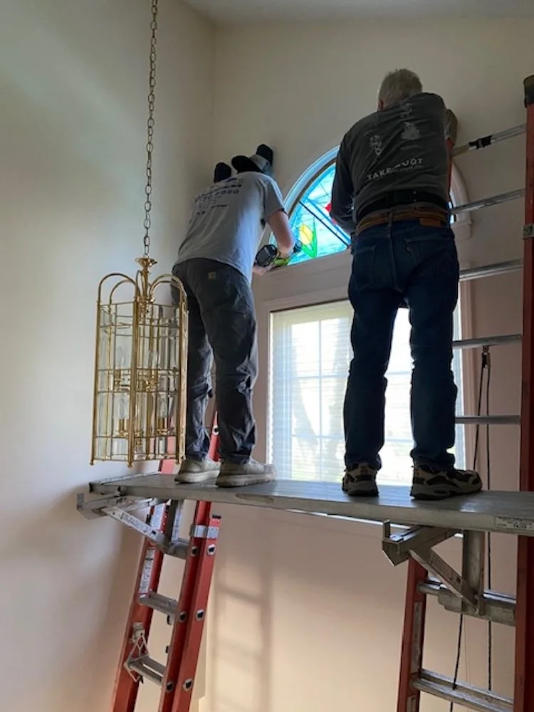 This shows Jesse and me working 20 feet up installing the window.