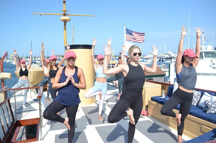 yacht bachelorette yoga in newport ocean front yoga event with Jessica Ackerman yoga teacher