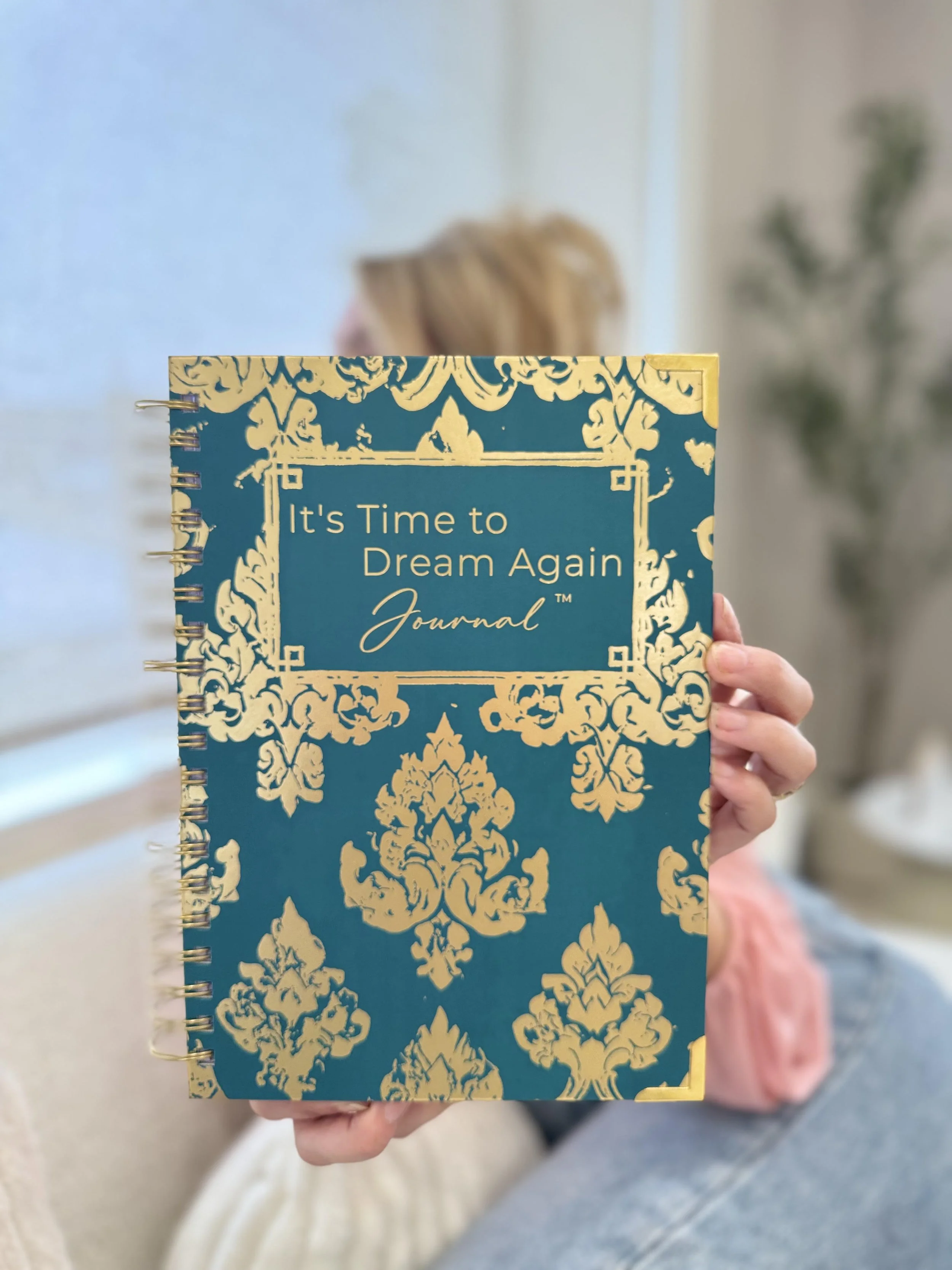 It's Time to Dream Again guided journal by Dawn Towne, a hardbound journal with gold coil binding and gold foil cover, shown with its gift box