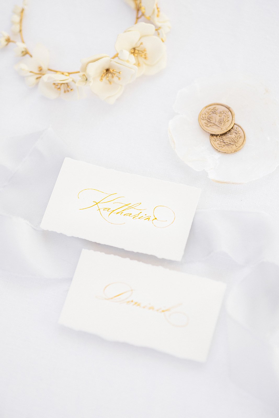 white-and-gold-calligraphy-place-cards.jpg