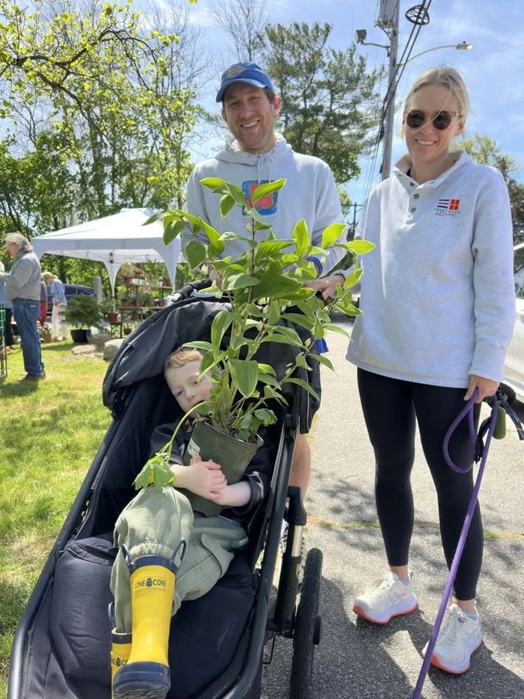 29-a-young-family-leaving-the-plant-sale-with-a.jpg