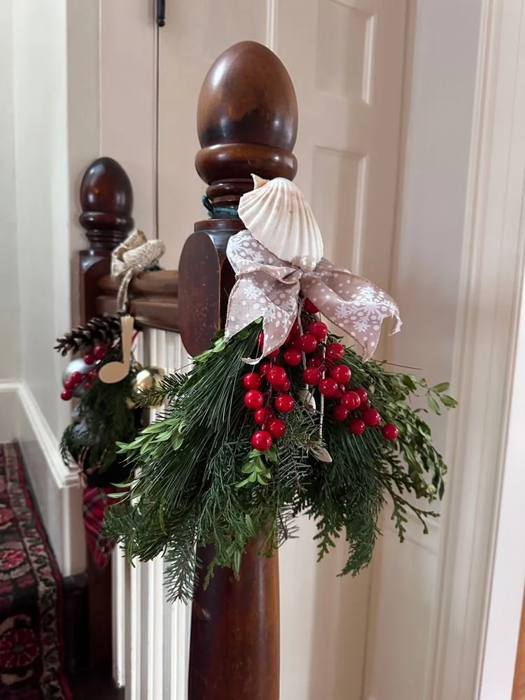 41-a-newel-post-dressed-with-greens-berries-and.jpg