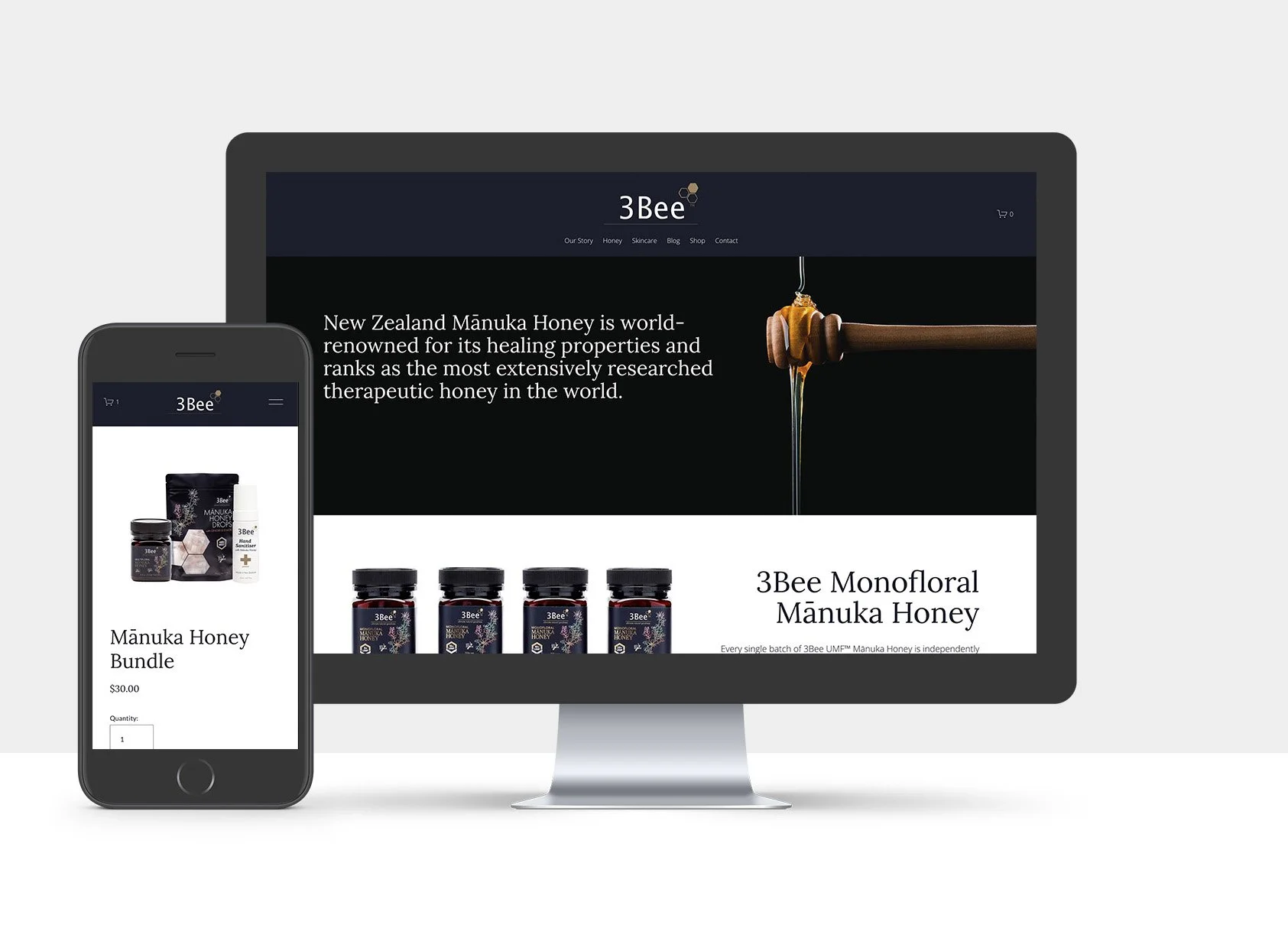 Computer monitor and smartphone displaying the 3Bee website, showcasing Manuka honey products, with text about New Zealand Manuka honey's therapeutic qualities.