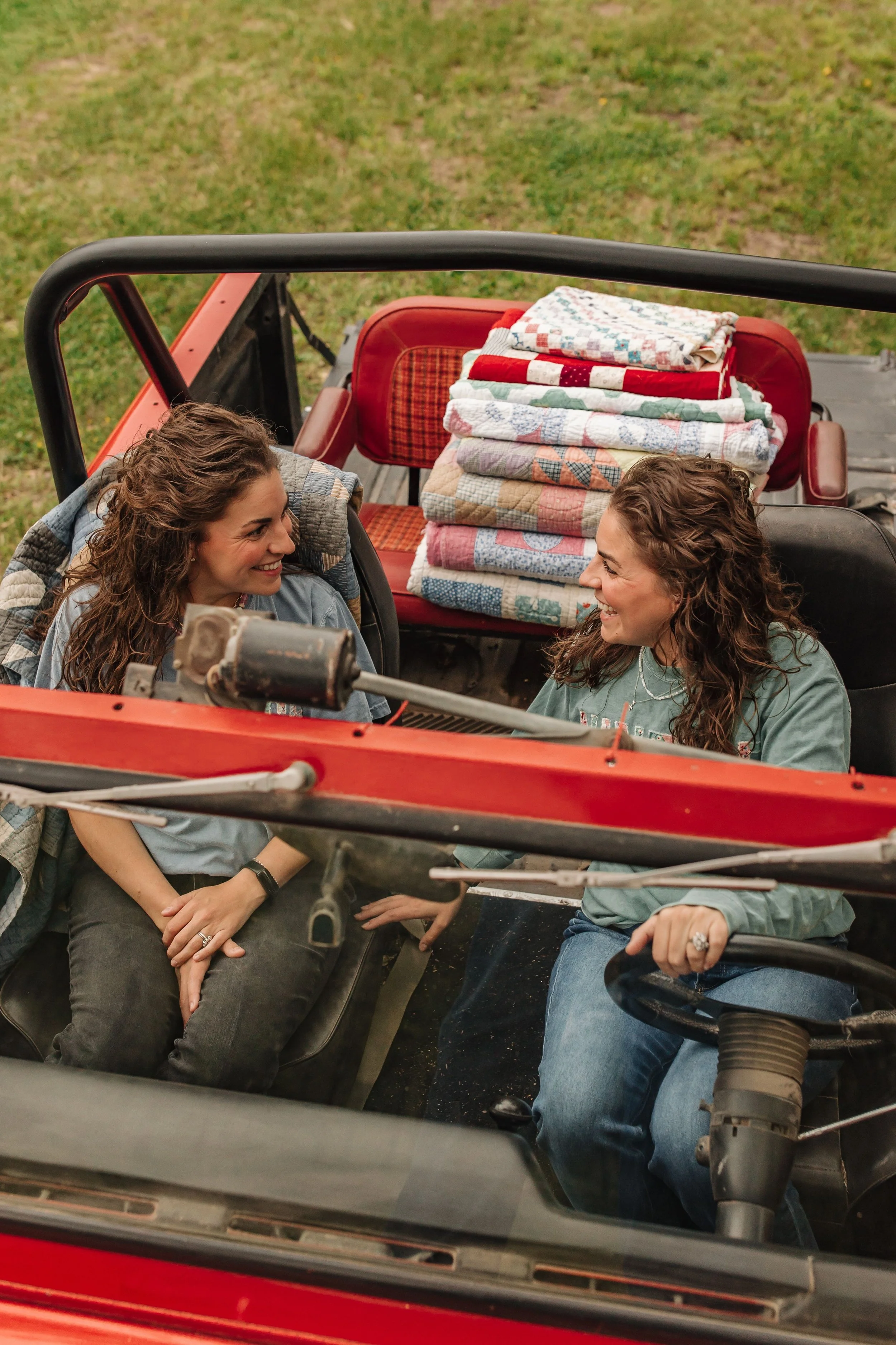 B&B in the old 69' bronco with a stack of vintage quilts
