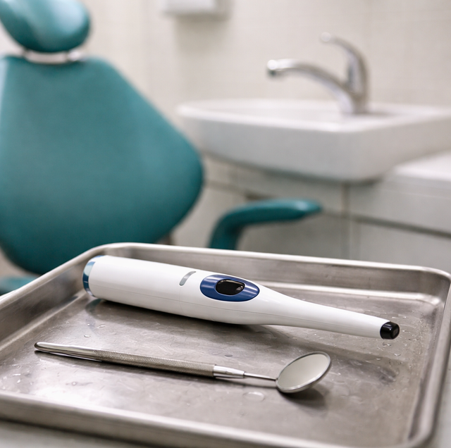 close-up of tongue with white coating beside mint and toothbrush