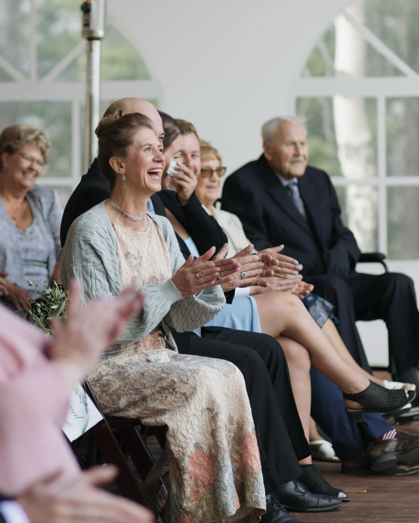 These are the kinds of photos that may not make it to your social media feed. 

They are photos of your small interactions with your spouse, your guests reactions, and silly moments when your wedding party catches a photographer in their direction. 
