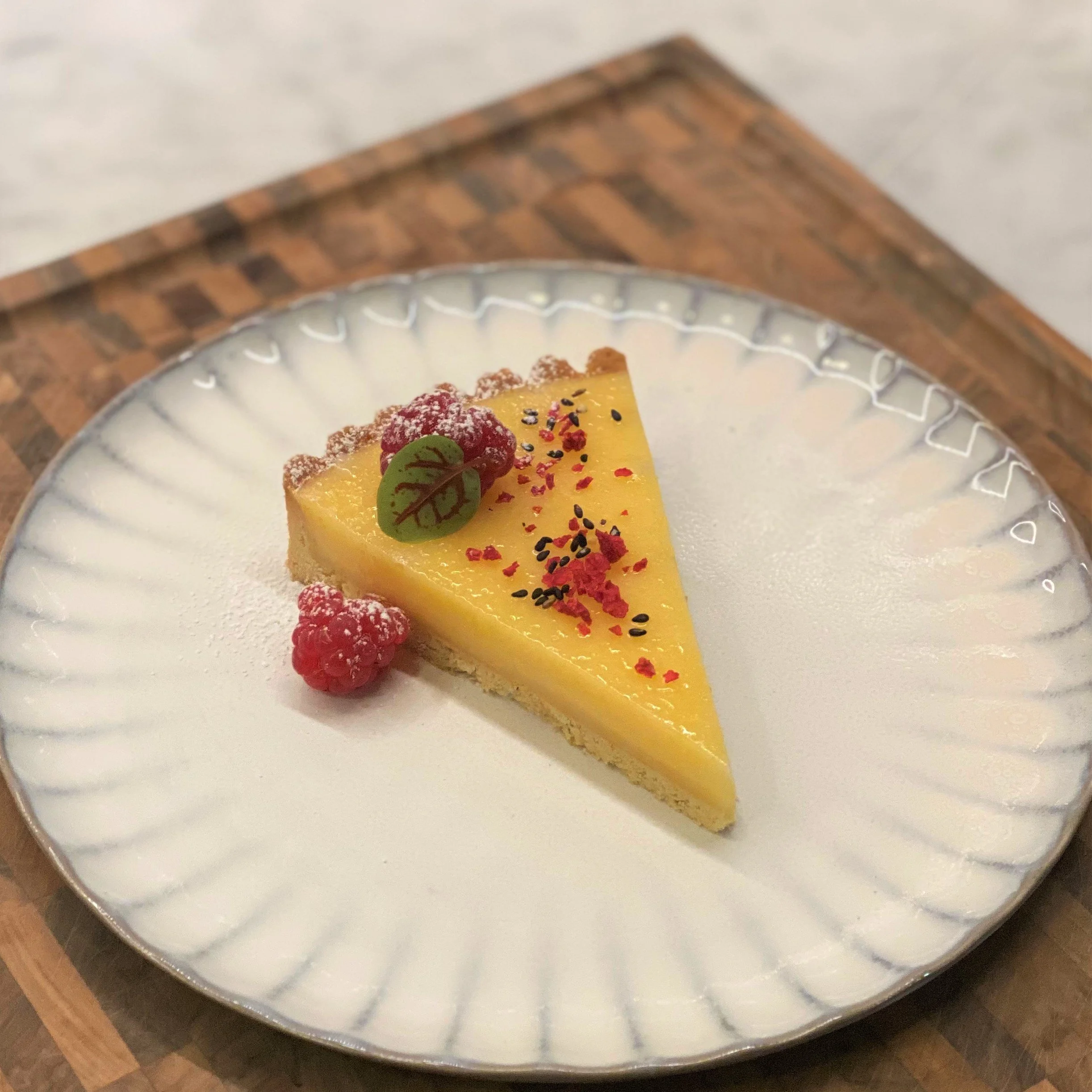 Yuzu tart raspberries.jpeg