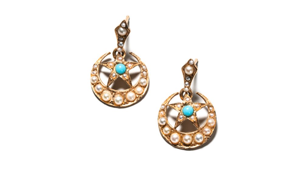    Dainty natural pearl and turquoise earrings with a star and moon motif, set in 14k yellow gold.   