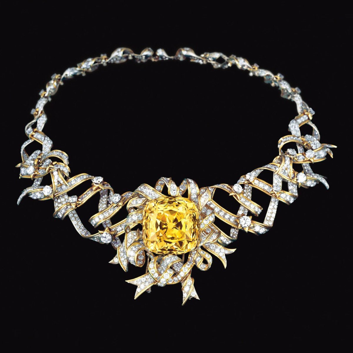 Diamond Ribbon Rosette Necklace featuring the famed Tiffany Yellow Diamond, 1961. Designed by Jean Schlumberger for Tiffany & Co. Worn by Audrey Hepburn in publicity photos for Breakfast at Tiffany’s.