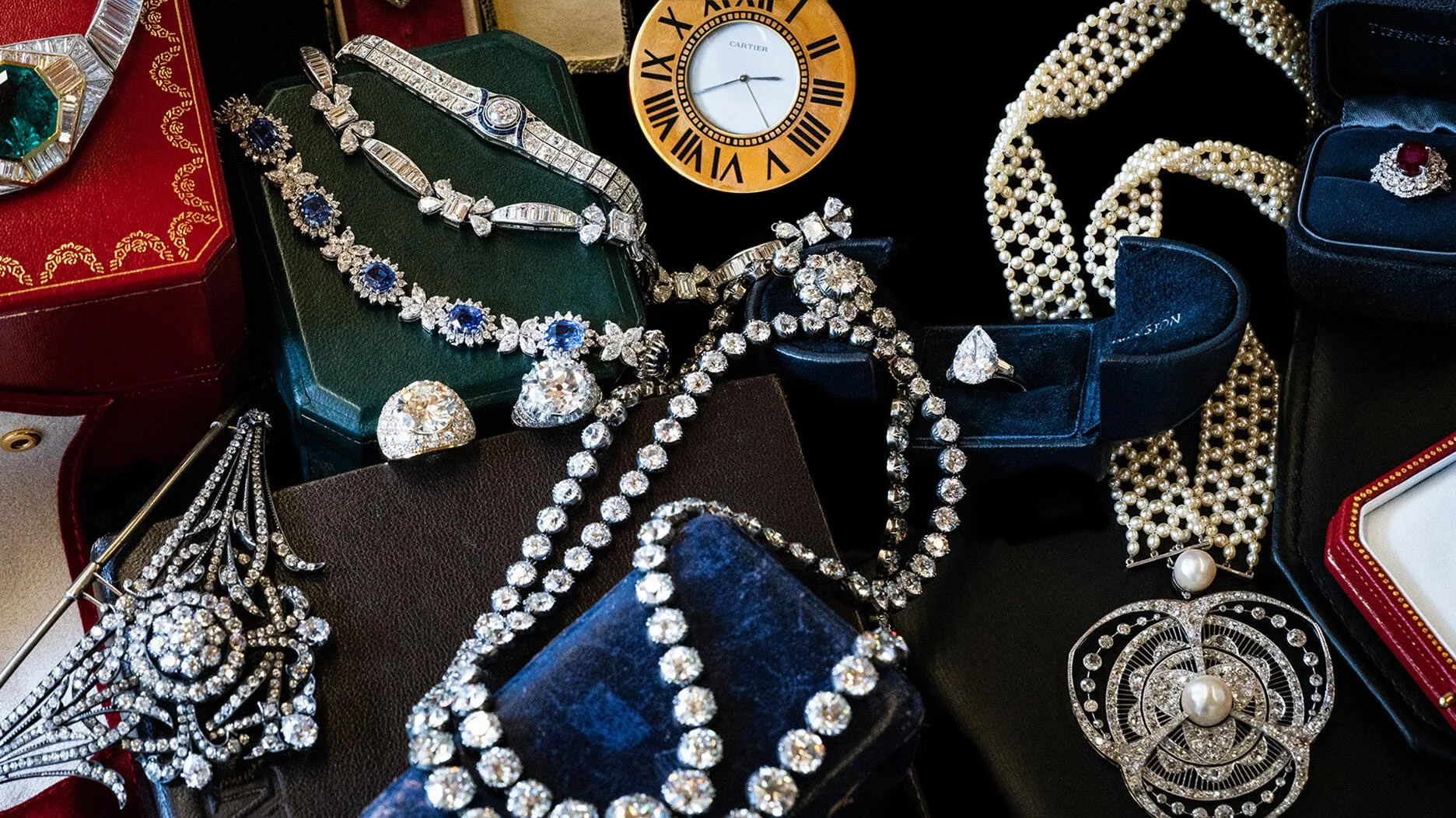 Antique riviera necklace with old European cut diamonds, a vintage Harry Winstone diamond engagement ring, a Chanel pearl and diamond pendant, a Cartier clock, a Tiffany ruby, among other fine jewels.