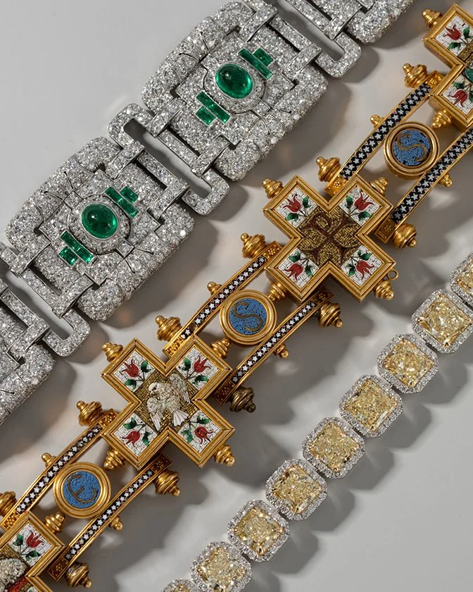 Antique, vintage, and contemporary bracelets. Art Deco diamond and emerald bracelet, vintage enamel bracelet, contemporary yellow and white diamond bracelet.