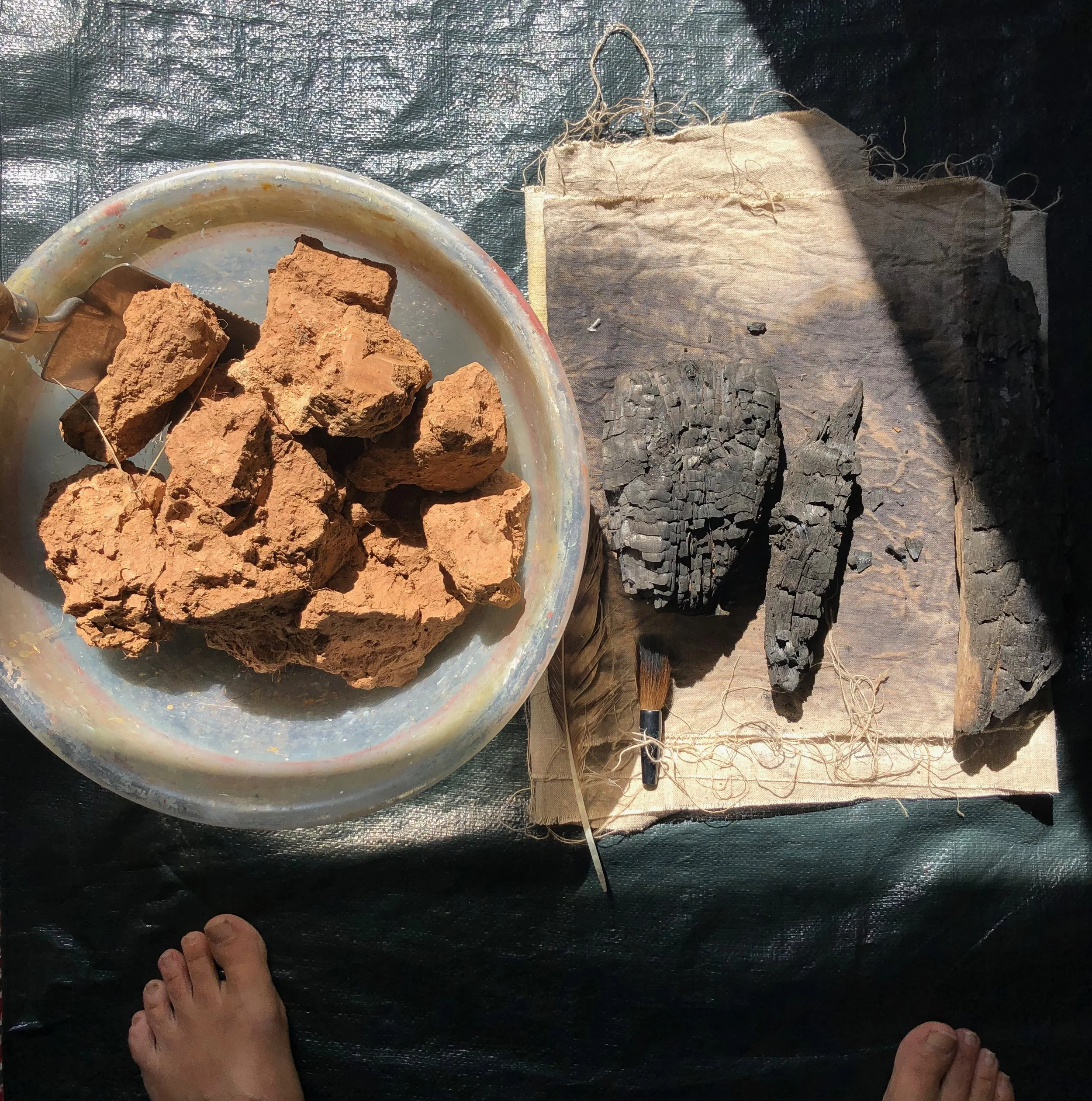 Clay earth, burnt wood and raw linen