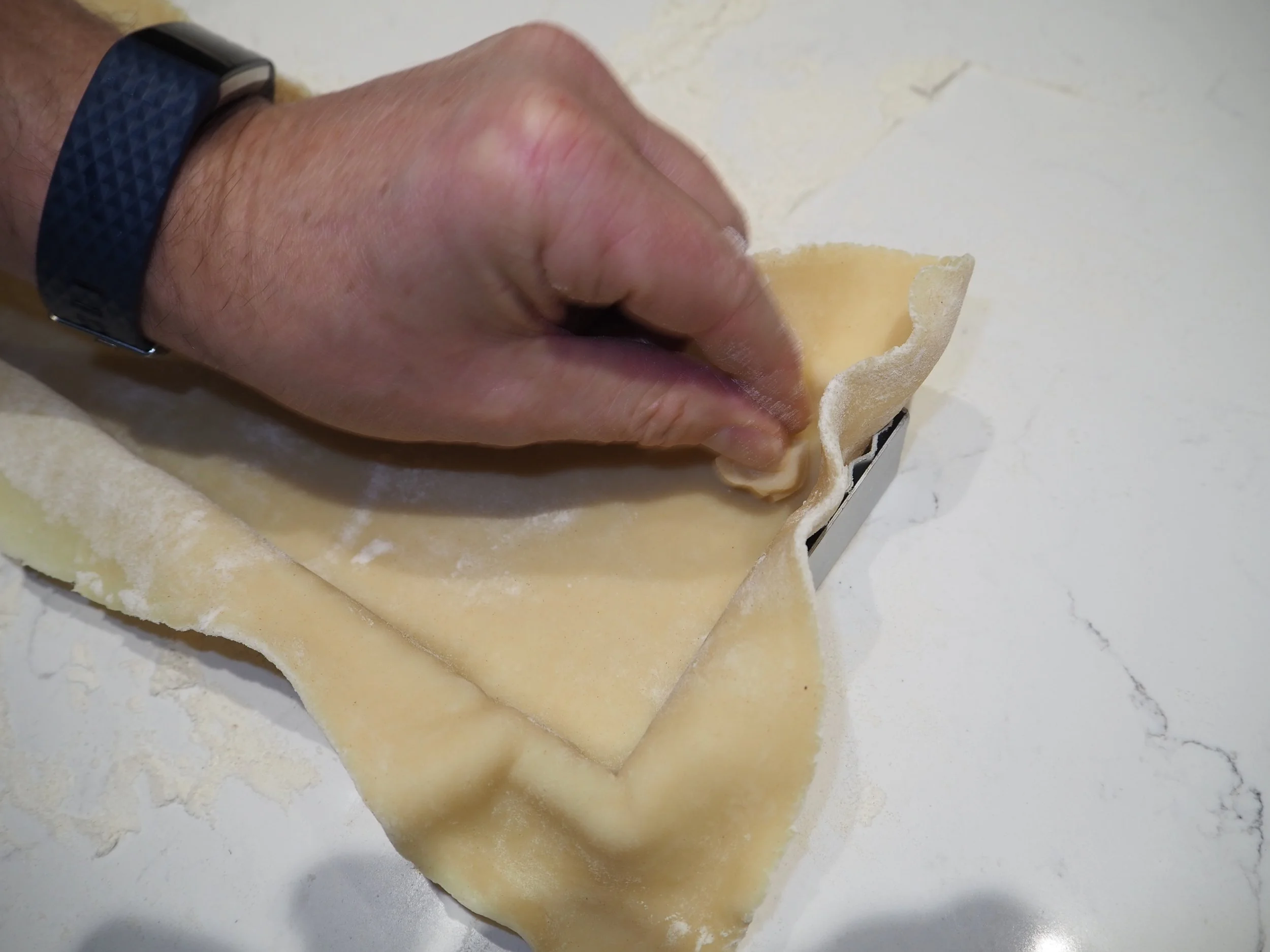 7. Pressing into the tin.JPG