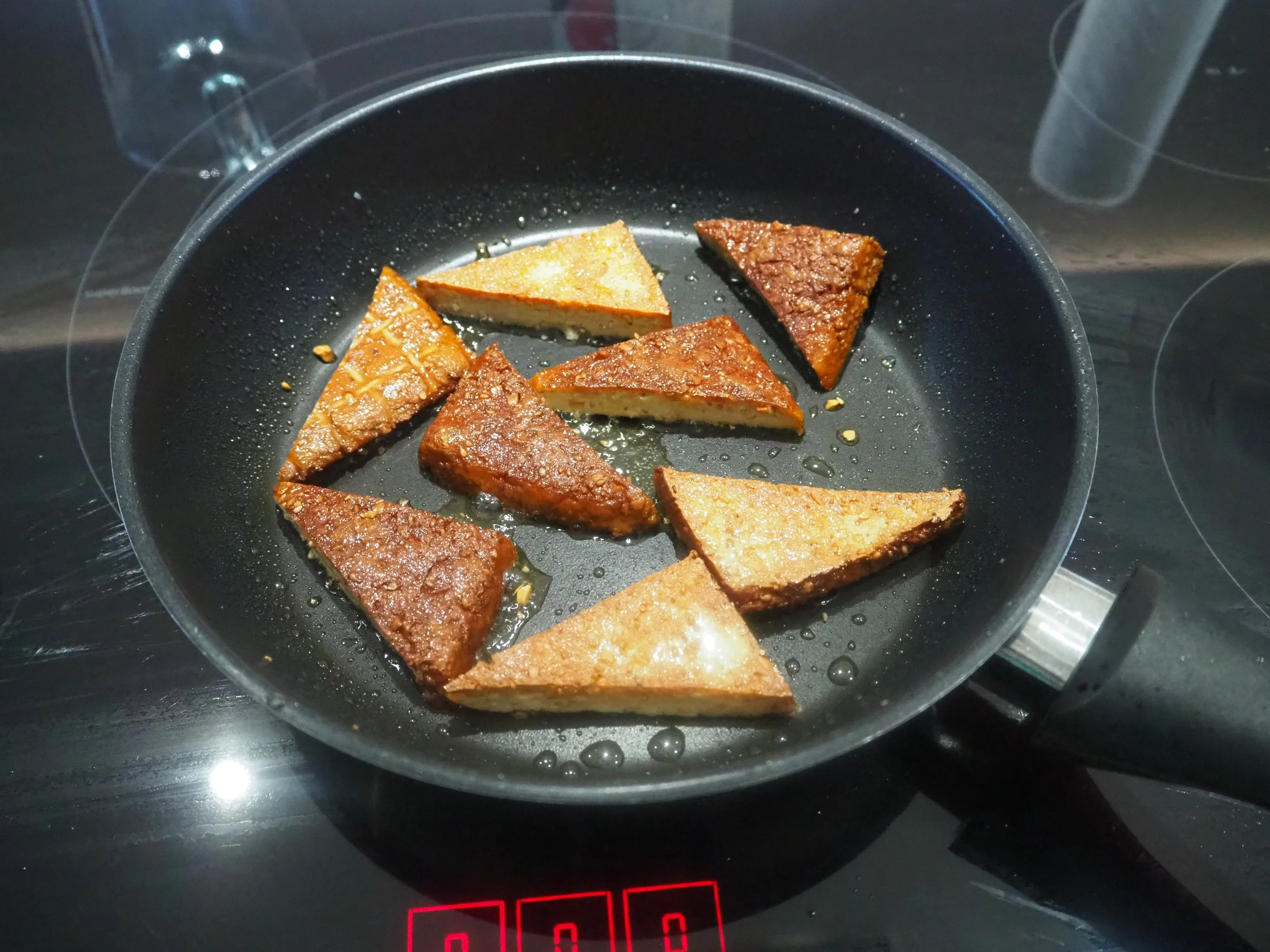 5. frying tofu triangles.jpg