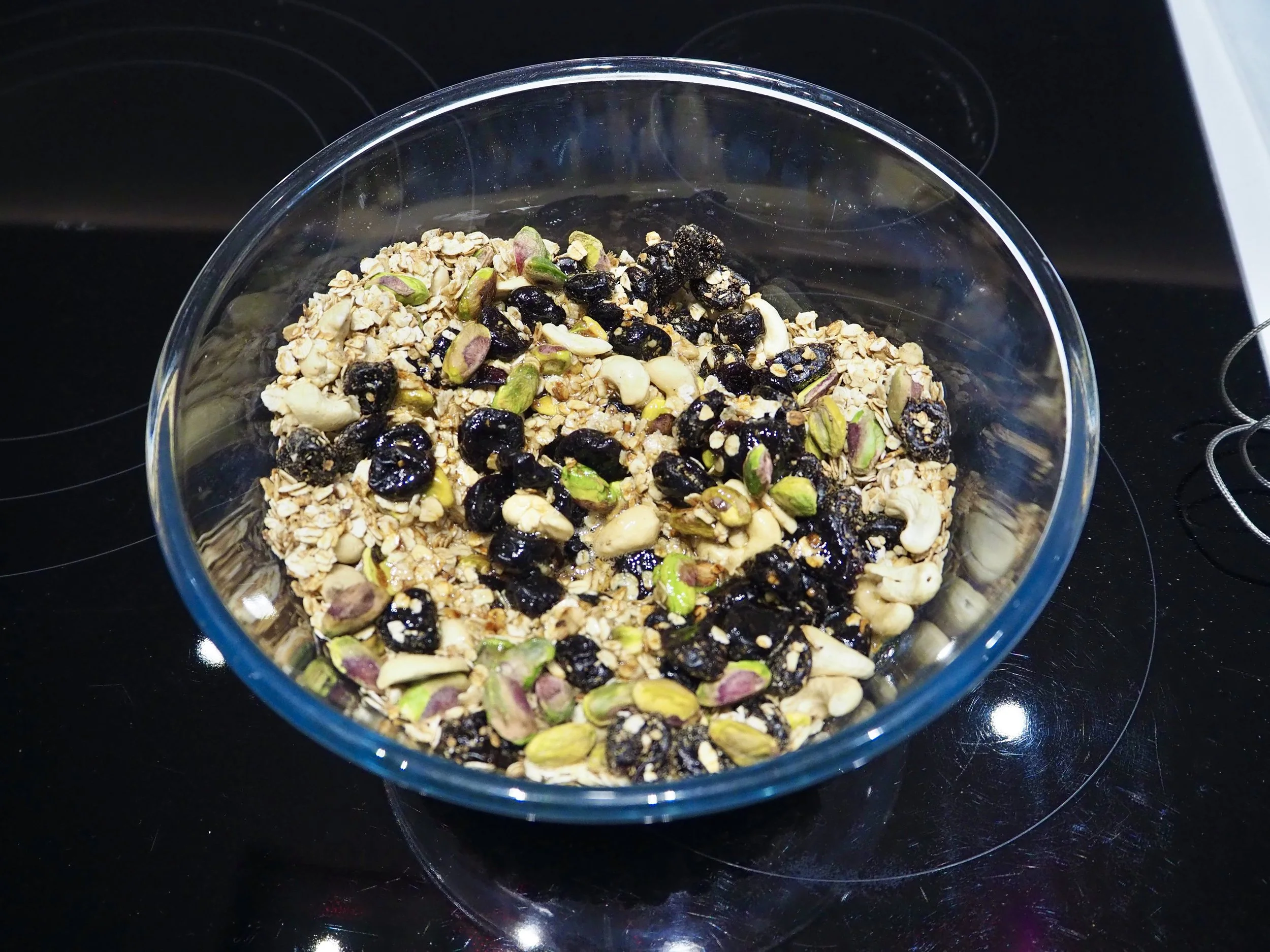 8. Sugar syrup coats the fruit & nuts.JPG