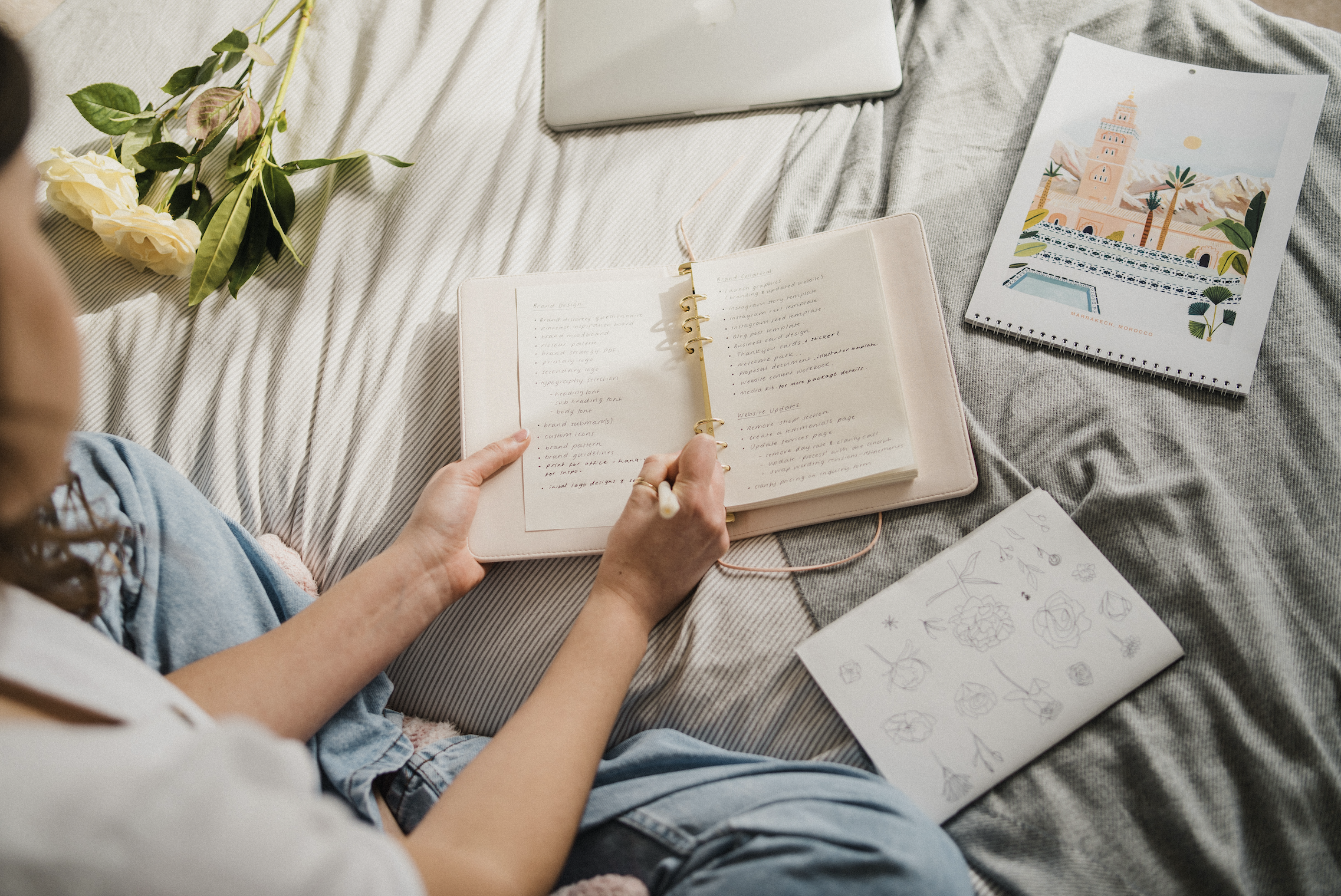 Close-up of brand naming notes written in a planner during the brainstorming process