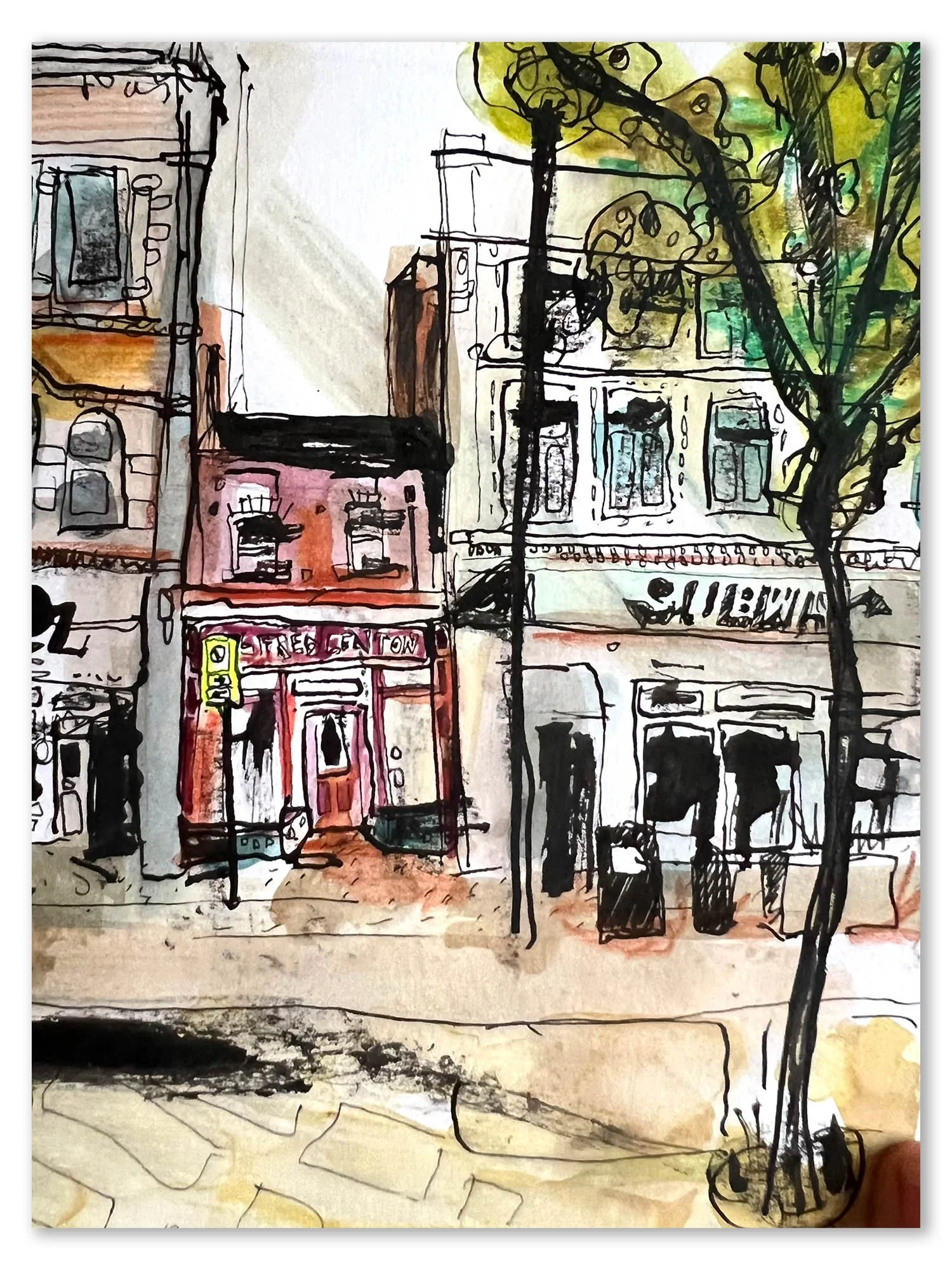 A hand-drawn watercolor sketch of buildings on a city street, including storefronts with large windows and a sign that reads 'STREET' with additional signage, alongside a tree with yellow and green foliage and a sidewalk with large paving stones.