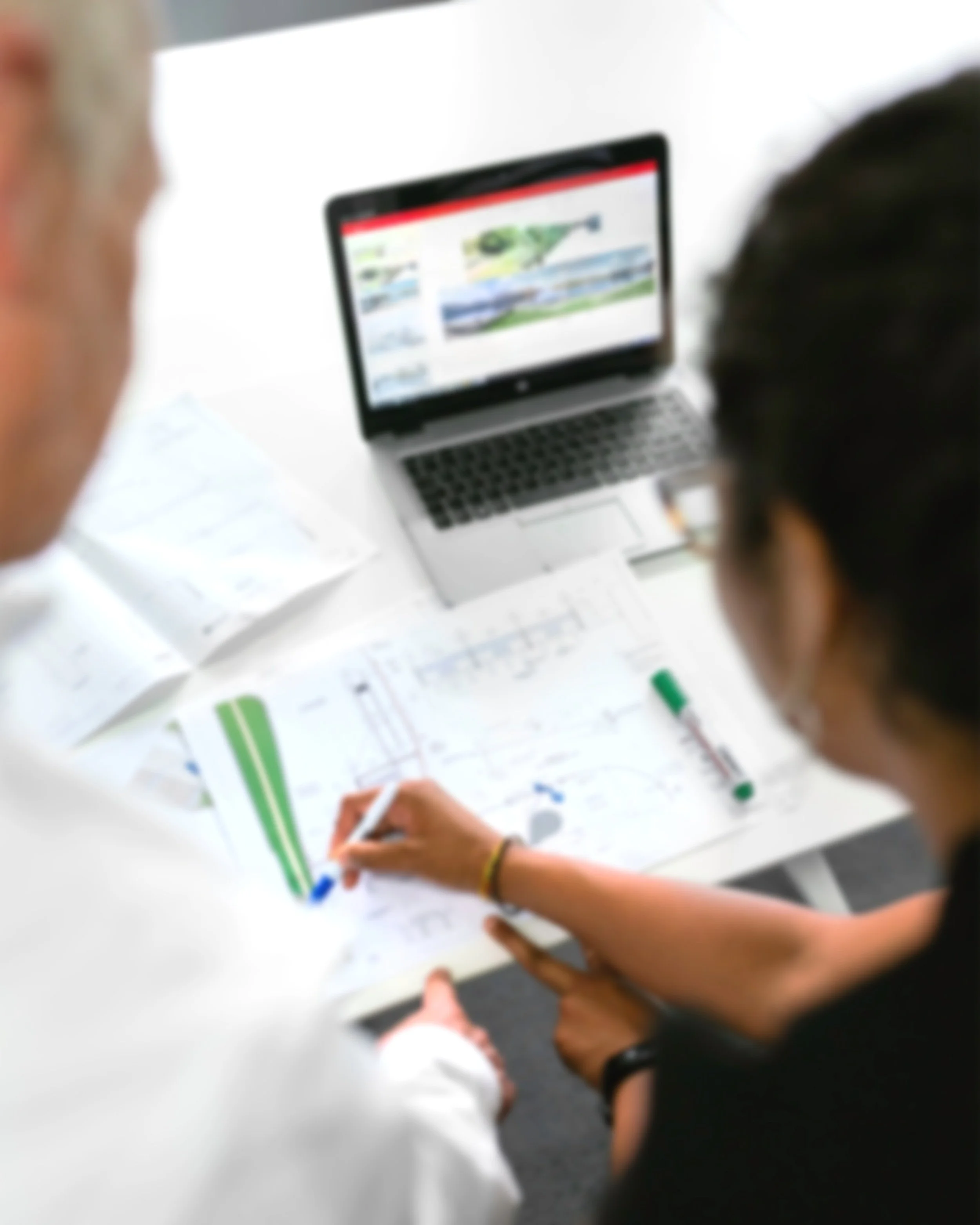 Two people collaborating on a report.