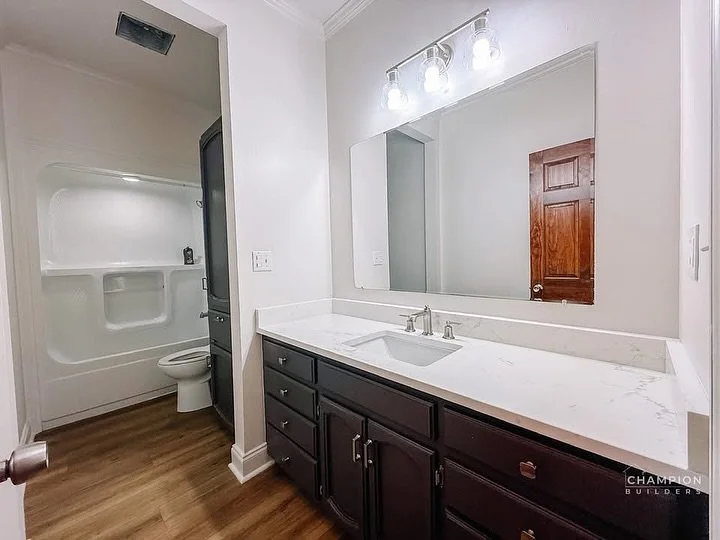 Part 3 Before ➡️ After of our Port Allen whole home remodel. The guest bathroom got a facelift. The dining room got a paint and lighting refresh. The living room had a configuration change with a new custom cabinet and shelves installed and the remov