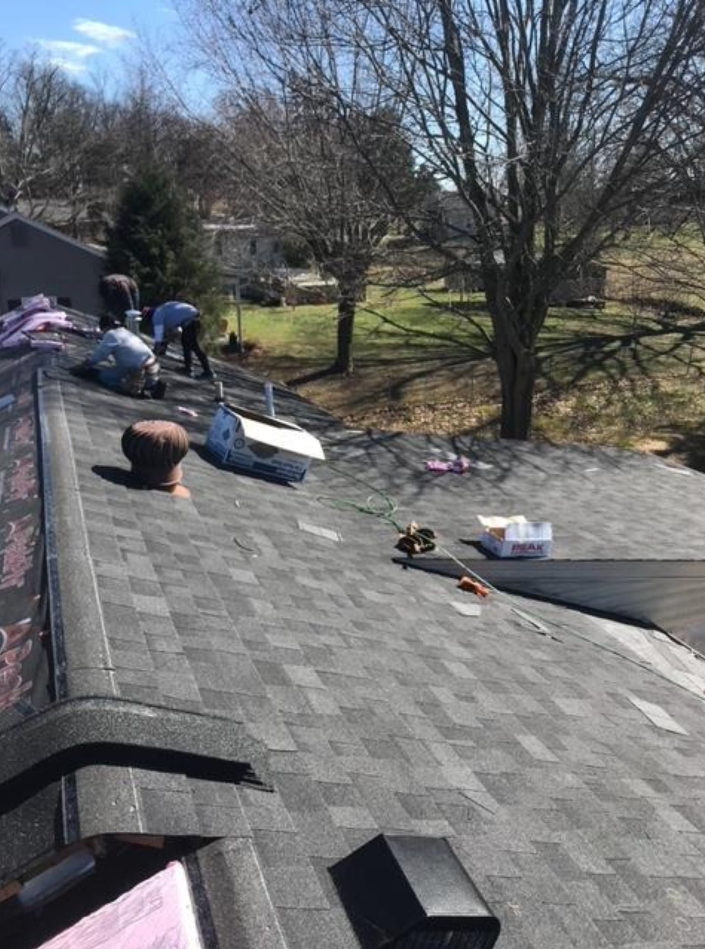 residential roofing contractor installing new roof