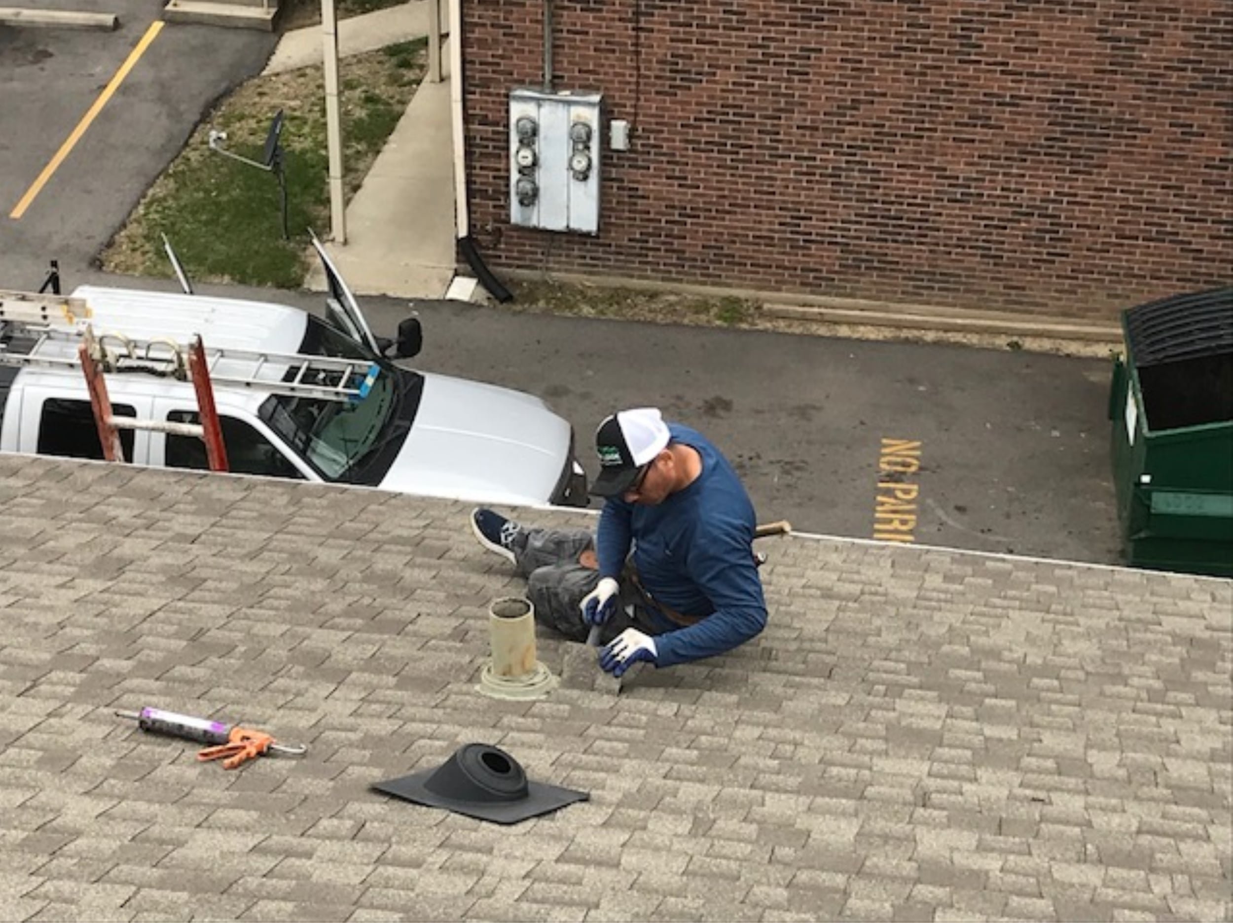 This team member is installing a new pipe boot. Often pipe boots deteriorate at the rubber seal over time causing leaks.