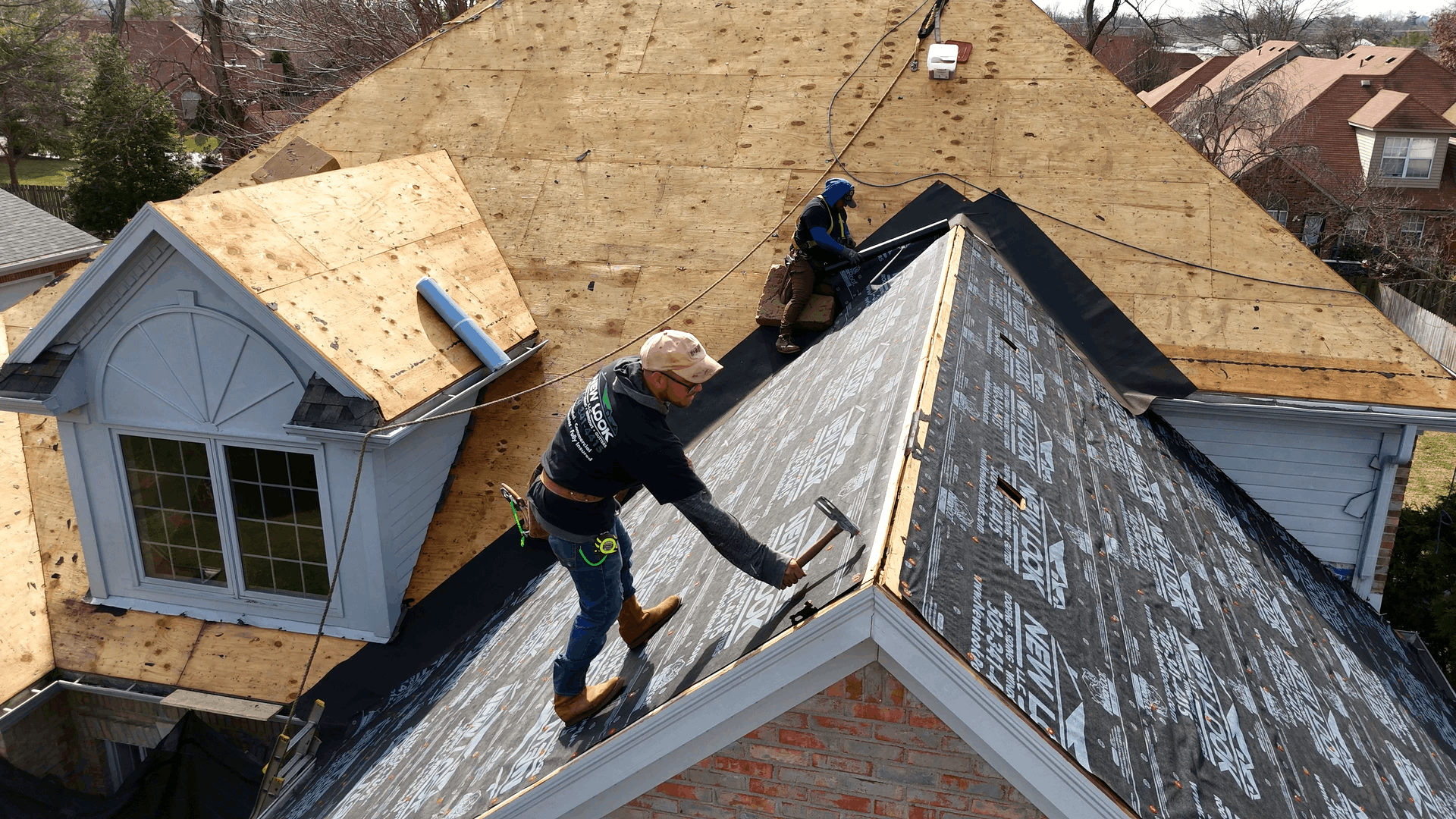 New Look Roof crew installing a new asphalt shingle roof on a Louisville Kentucky home