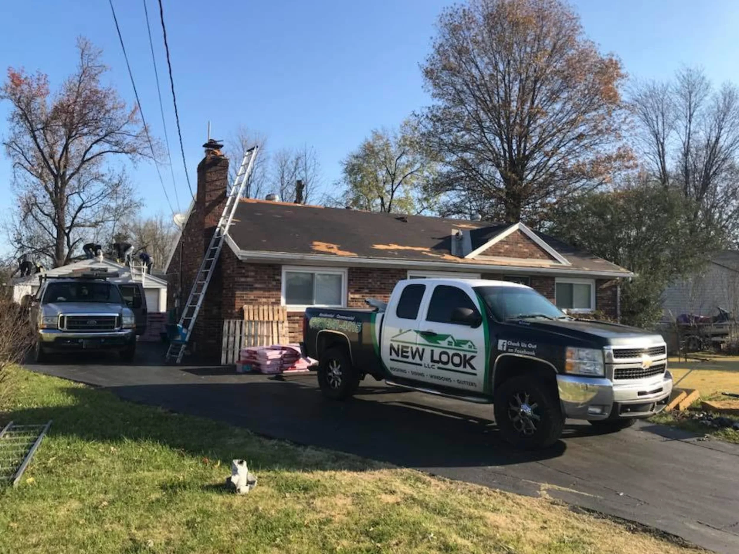 new look roof vehicle in driveway of residential house