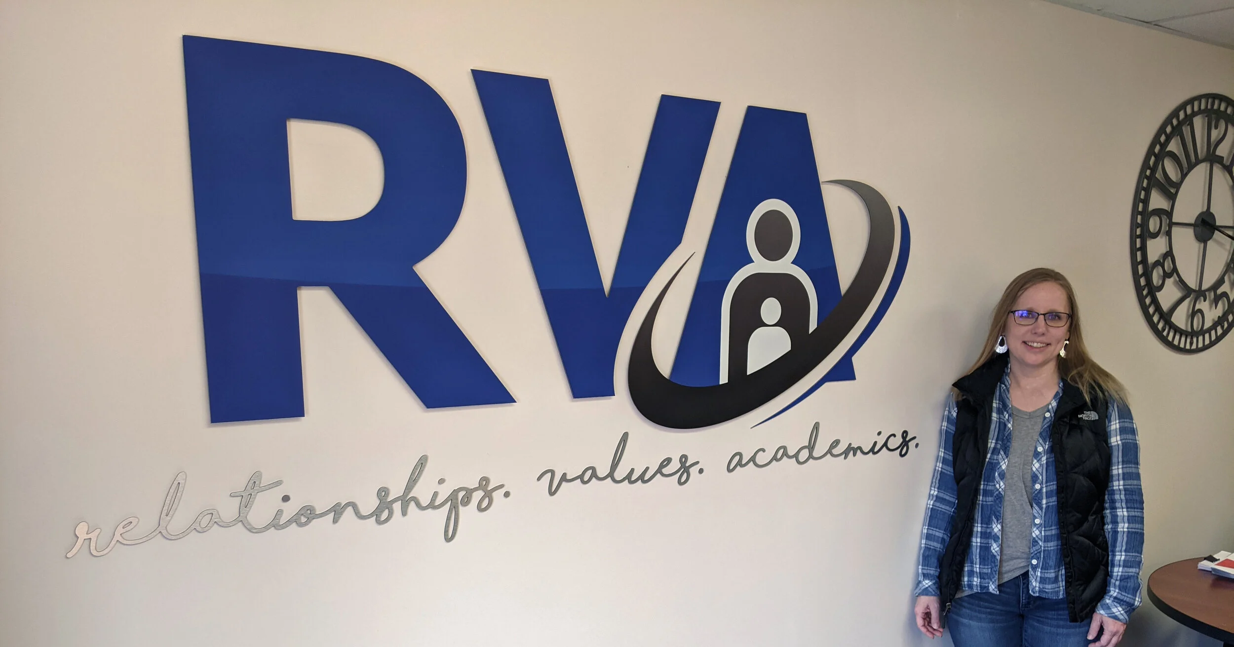  Blue Rural Virtual Academy (RVA) custom logo sign printed on brushed aluminum and router cut to logo letters and script tagline shape by SUN Printing. 