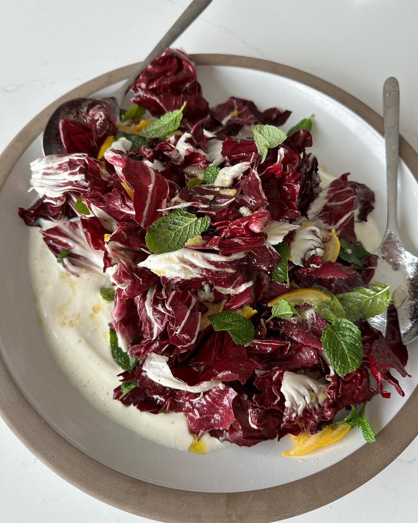Birthdays are my favorite excuse to experiment in the kitchen and try new recipes! This one is from @alisoneroman  It&rsquo;s a gorgeous raddichio salad with mint and a preserved lemon vinaigrette. It&rsquo;s on top of a lemony yogurt bed. This is ve
