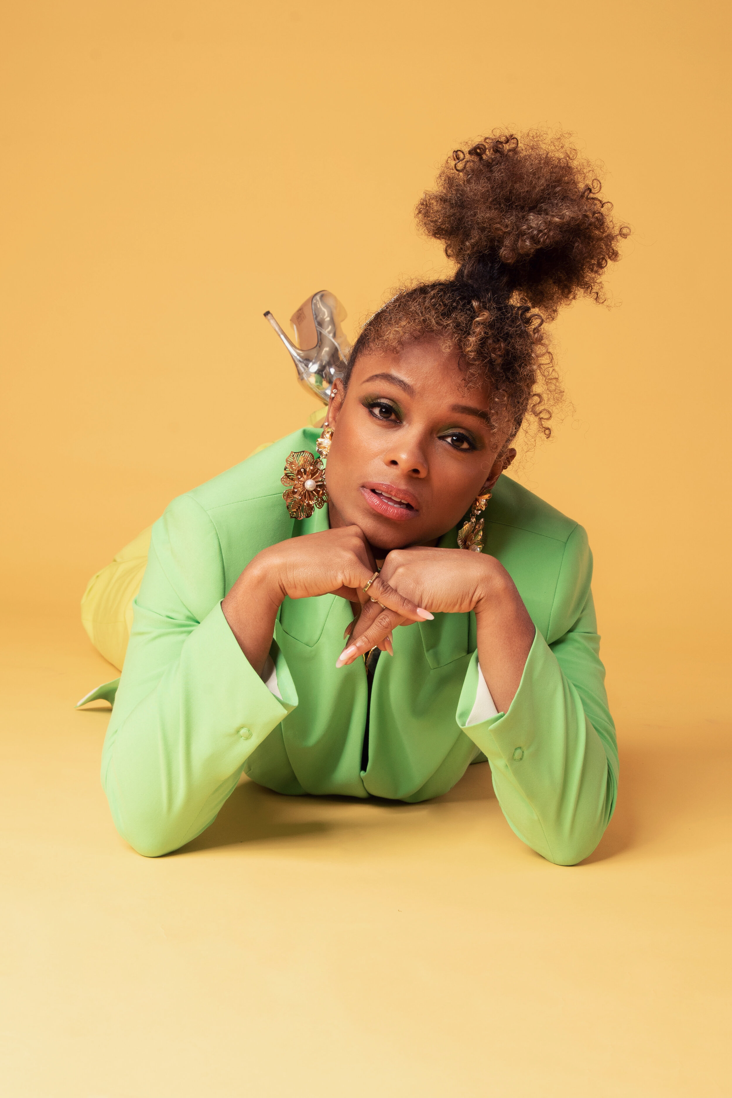 Fleur East for Darkus Magazine — Green suit, lying to camera