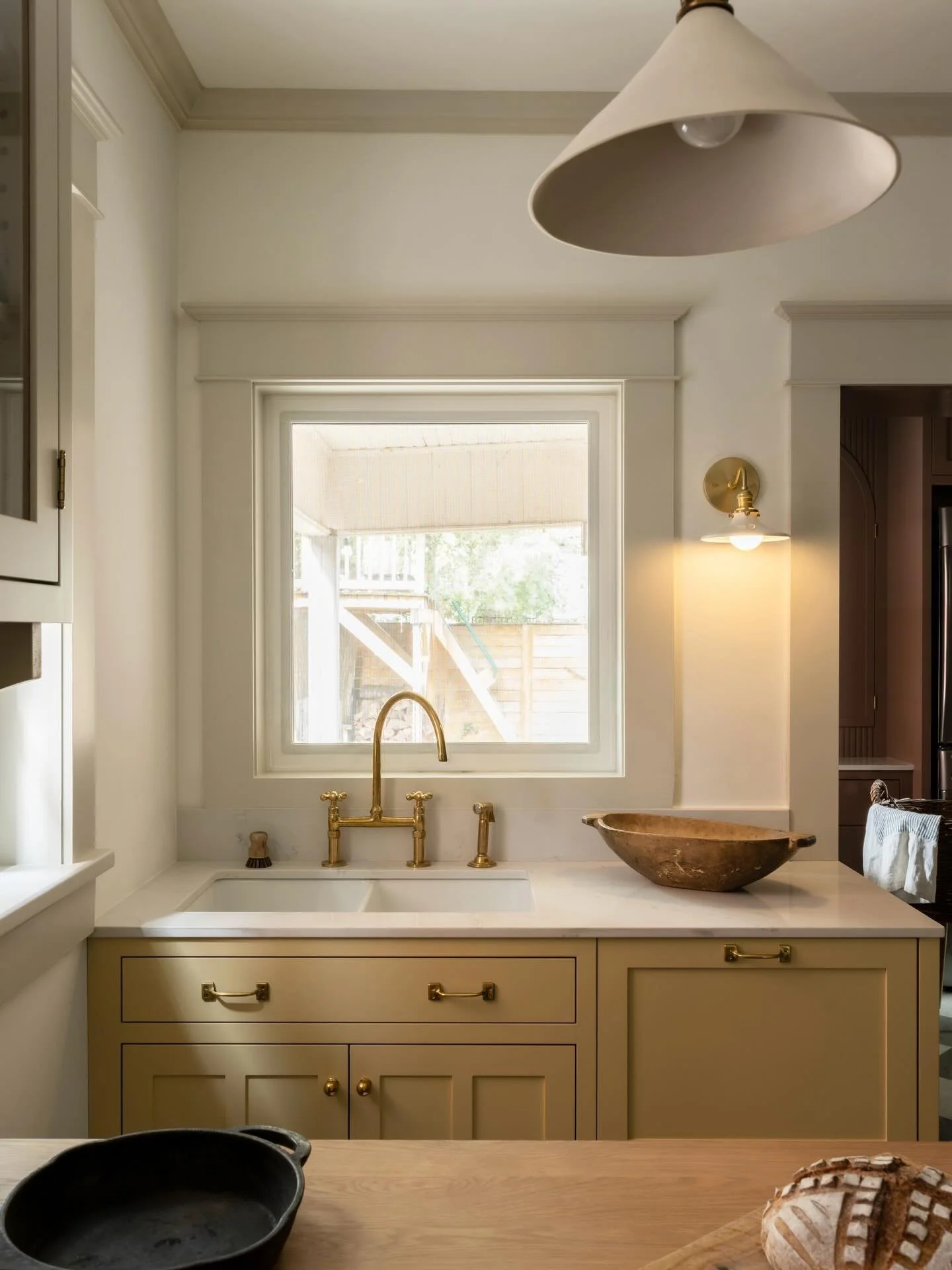 This buttery yellow sink cabinet might be small in scale, but it carries so much intention.

In chatting with the homeowners, one thing we knew early on was that we wanted to create a clearly defined dish-washing zone. Rather than long, continuous ru