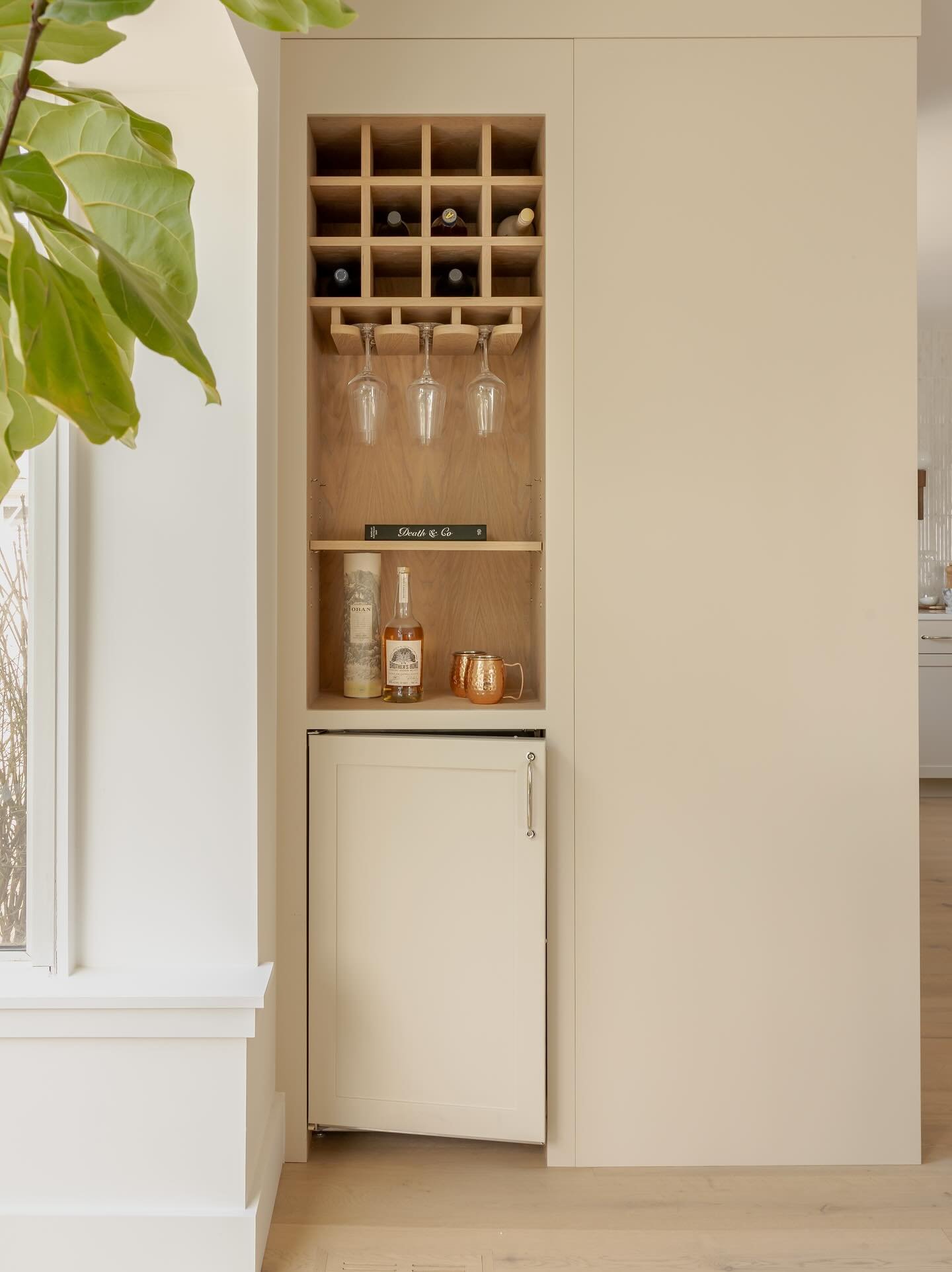 Sometimes the best design details come out of little quirks in a space. When we removed the wall between the kitchen and dining room in this home, it left a small jog and we leaned into it.

We extended the cabinetry along this wall and turned the co