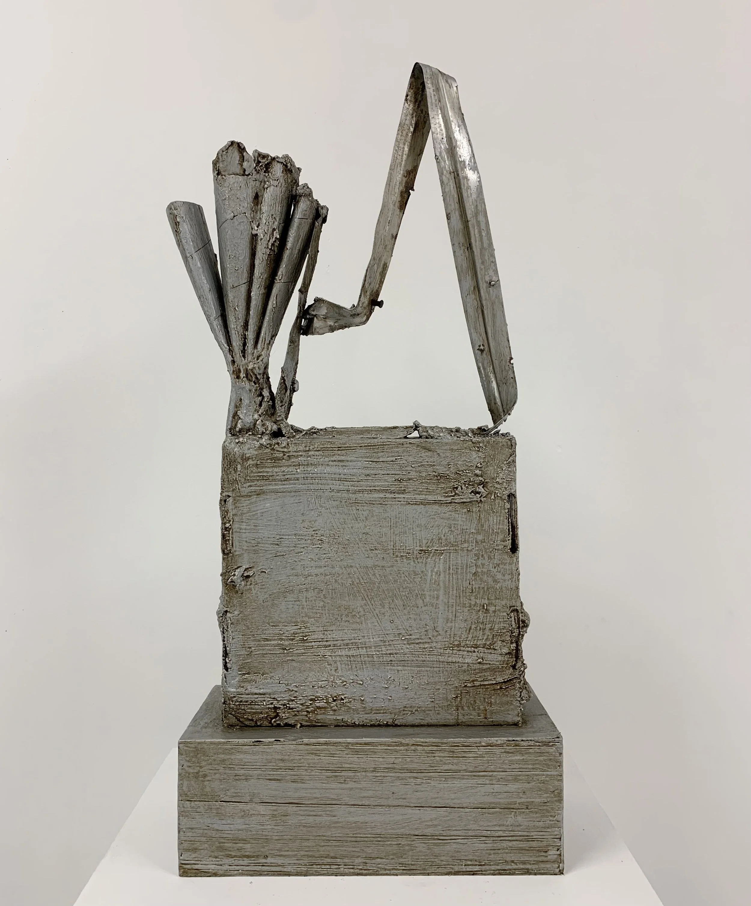 Rhymer, 2023, wood, plaster, aluminum, glue, paper, screws, aqua resin, enamel, wax, 26" x 12" x 5.5"