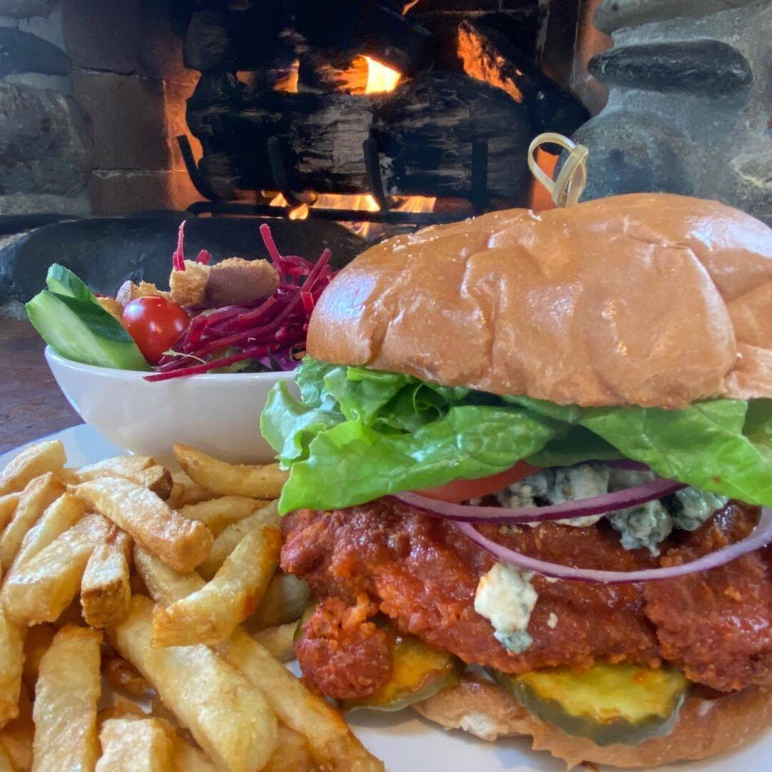 Cozy up by the fire and enjoy the heat of this feature burger. 🔥

The Blue Moon Chicken Burger is a crispy chicken burger, dipped in Frank's hot sauce, with blue cheese, lettuce, tomato, red onion, cripsy bread and butter pickles and honey ranch. 🌙