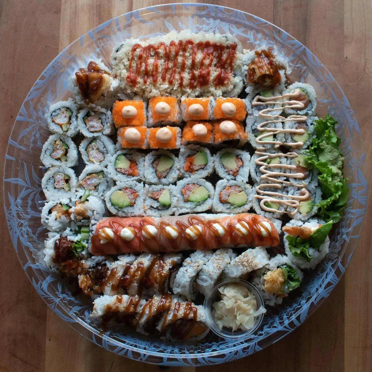 Just in time for the holidays our December Platter is now available! This month enjoy our new Super Cucumber &amp; Cheese roll, alongside the returning Dynamite &amp; Avocado Roll.
Paired with a selection of Daruma Classics, the December platter is p